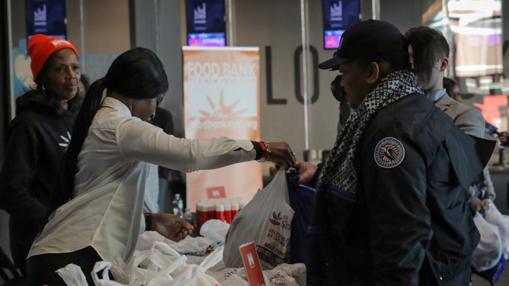 TSA workers line up at a food bank.