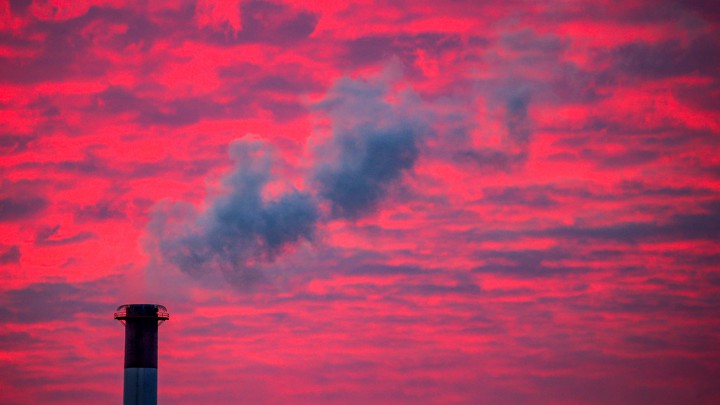 Steam rises from a smokestack at sunset in Lansing, Michigan, in January 2018.