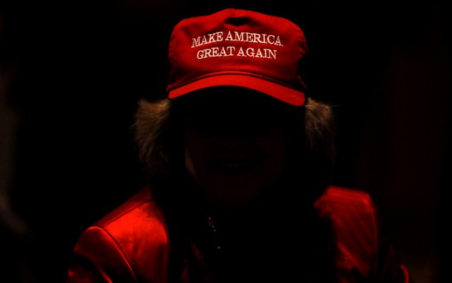 A Trump supporter wears a "Make America great again" hat