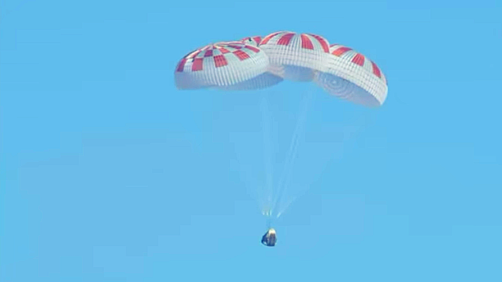 Parachutes soften the descent of SpaceX's Dragon spacecraft on its return to Earth.