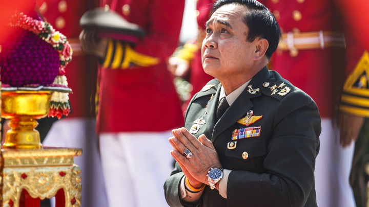Prayuth Chan-ocha, the head of Thailand's military junta, prays at a military parade in 2014.