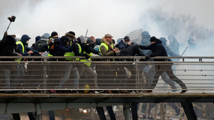 Yellow-vest protesters clash with police in Paris in January 2019.