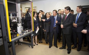 Chinese president Xi Jinping examines Huawei technology during a presentation in London in 2015.