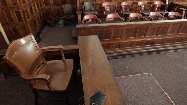 A witness stand and a jury box