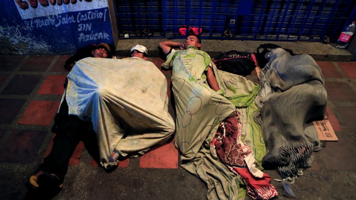 Venezuelan migrants sleep on makeshift beds in the streets of Maicao, Colombia, in February.