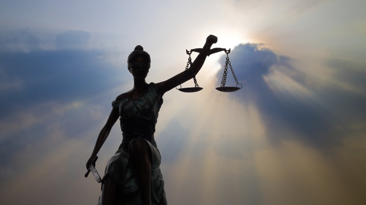 A statue of "Lady Justice" holding the scales of justice