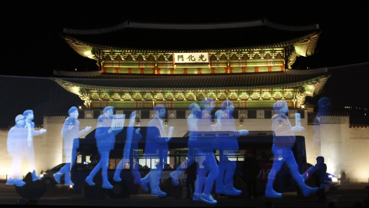 Holograms of protesters are shown in front of Gyeongbok Palace in South Korea