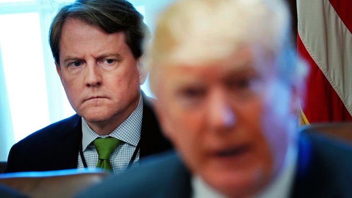 White House Counsel Don McGahn sits behind President Donald Trump at a Cabinet meeting in the White House.