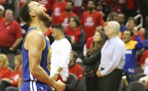 The Golden State Warriors guard Stephen Curry reacts after defeating the Houston Rockets on Friday.