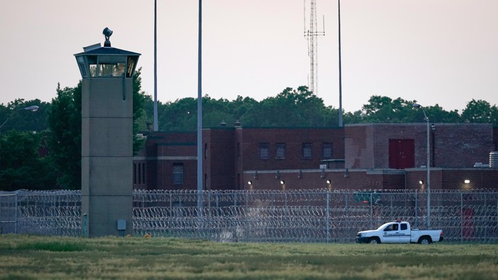 A corrections vehicle patrolled near the Federal Corrections Complex where John Walker Lindh was released from prison today