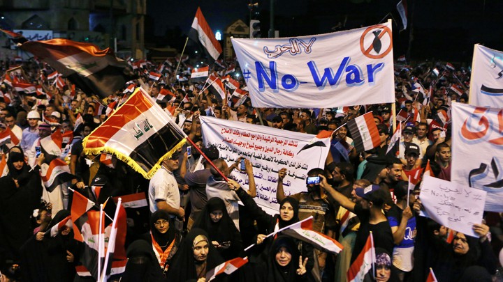 Followers of the Iraqi Shiite cleric Moqtada al-Sadr attend a rally in Baghdad saying Iraq should not be a battlefield between the U.S. and Iran.