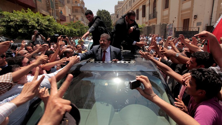 Mohamed Morsi greets supporters during Egypt's June 2012 presidential election.