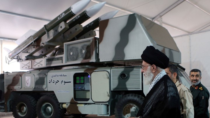 Ayatollah Ali Khamenei is seen near a "3 Khordad" system, which is said to have been used to shoot down a U.S. military drone.