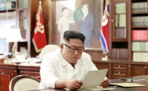 North Korean leader Kim Jong Un reads a letter from American President Donald Trump.