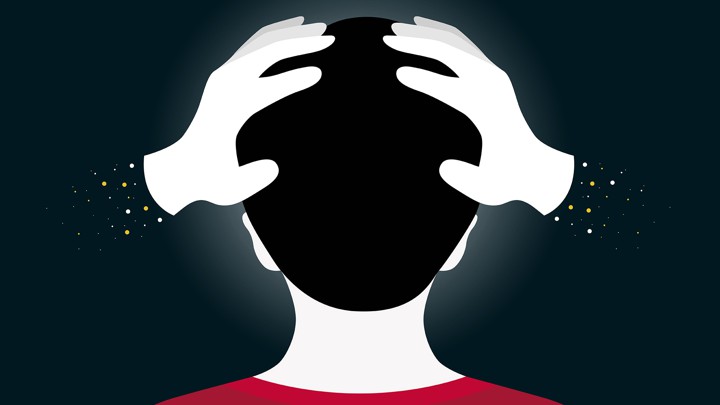 An illustration of hands squeezing a child's head
