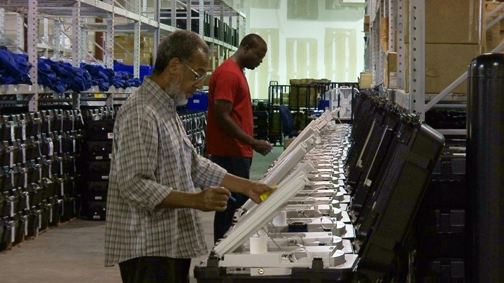 Voters use electronic voting machines.