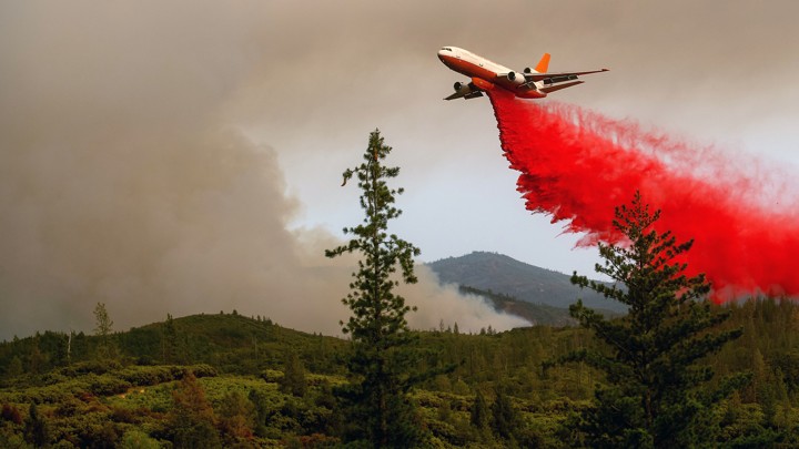 An air tanker drops retardant while battling the Ferguson Fire in the Stanislaus National Forest, near Yosemite National Park, California, on July 21, 2018.