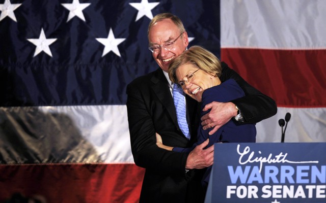 Elizabeth Warren and her husband, Bruce Mann, hug.
