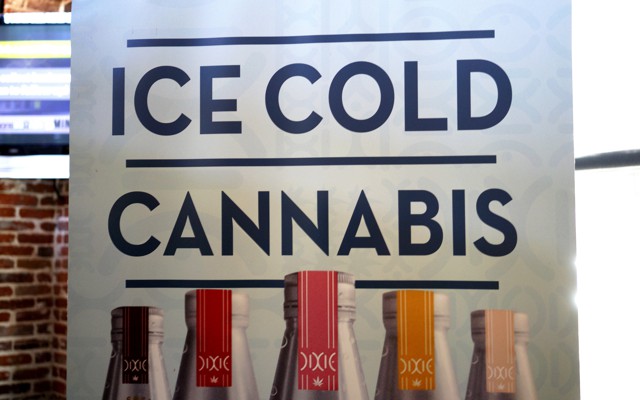 A banner hangs at the Dixie Elixirs company booth at the CannaSearch cannabis-industry job fair in downtown Denver on September 16, 2014.