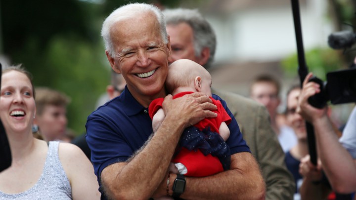 Joe Biden holding a baby