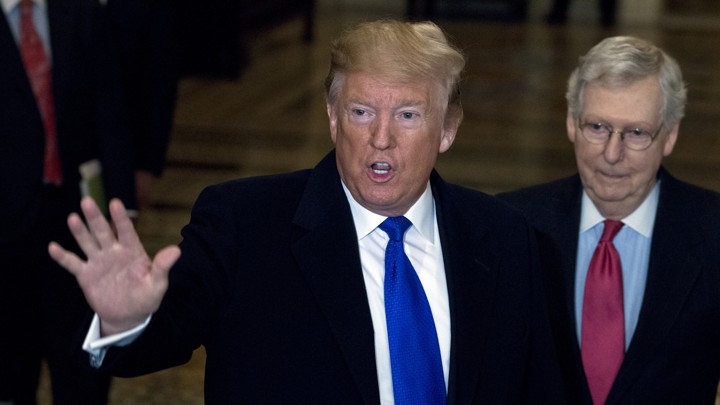 President Donald Trump (left) stands next to Senate Majority Leader Mitch McConnell in the Capitol in March.