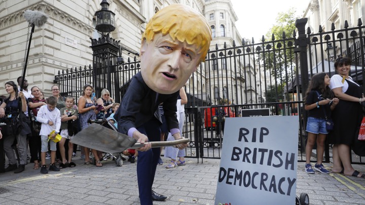 Protester in Boris Johnson mask
