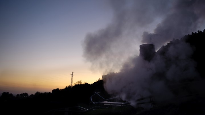 A cloud of steam washes over a mountain
