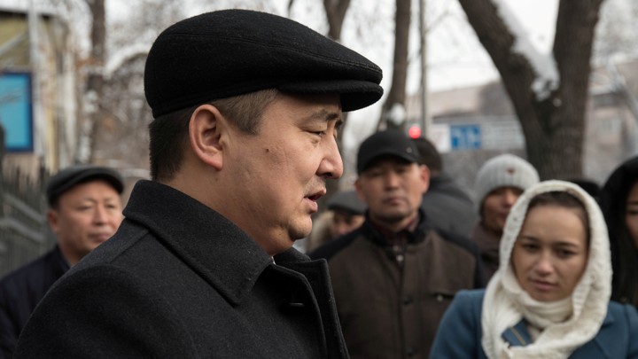 Serikzhan Bilash addresses reporters outside a courthouse in Almaty, Kazakhstan.