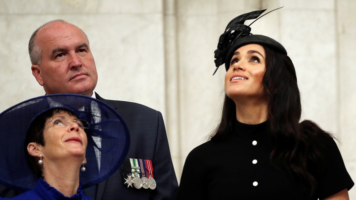 Meghan Markle looks upward.