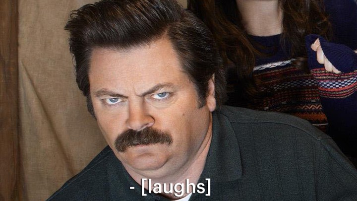 The actor Nick Offerman stares angrily at the camera, with a caption say that says "Laughs."