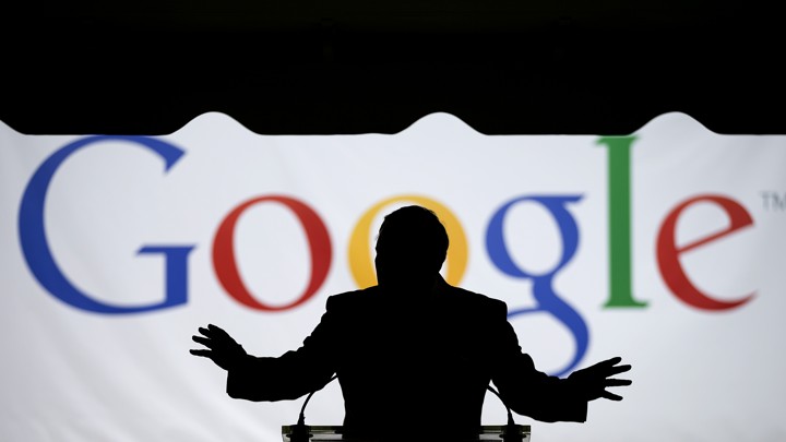 Georgia Governor Nathan Deal speaks silhouetted in front of a large screen that says "Google."