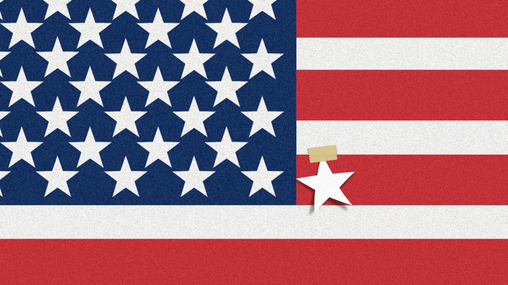An image of an American flag, but with an extra white star taped on one of the red stripes.