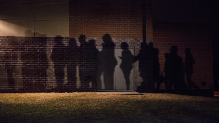 The shadows of voters lined up outside a 2016 caucus location in West Des Moines, Iowa.
