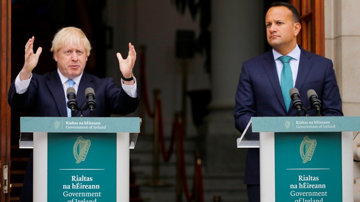 British Prime Minister Boris Johnson and his Irish counterpart, Leo Varadkar, stand behind lecterns to address the press.