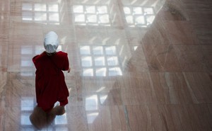 Protester dressed as a Handmaid