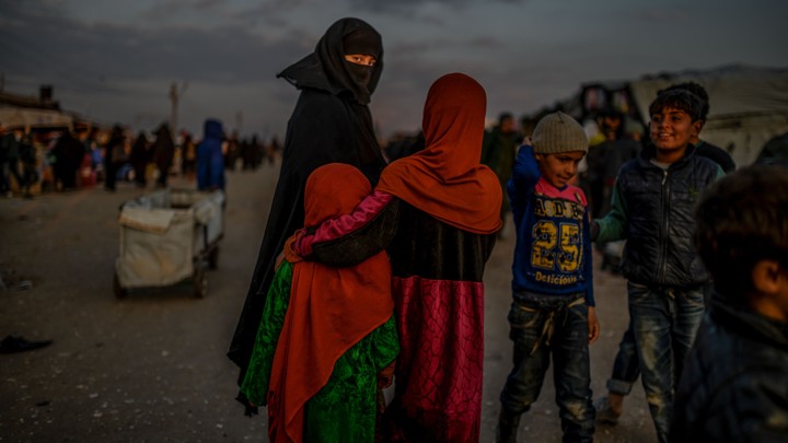 A veiled woman looks back at the camera in the al-Hol camp in northern Syria.