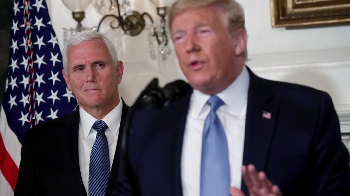 President Donald Trump delivers remarks in the White House Diplomatic Reception Room with Vice President Mike Pence standing behind him.