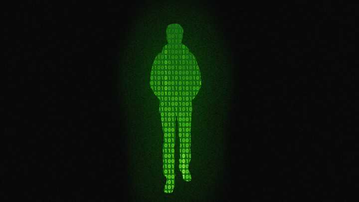A green silhouette of a person with changing binary code set against a black background.