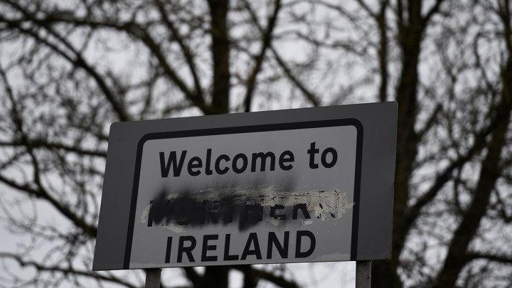 A sign that reads "Welcome to Northern Ireland" with the word "Northern" scratched out.