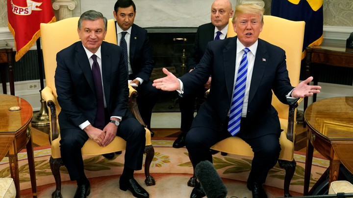 Donald Trump gestures as he meets with Shavkat Mirziyoyev at the White House.