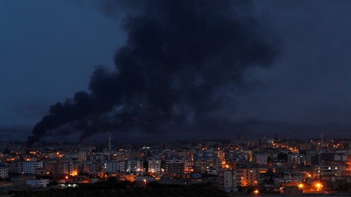 Smoke rises over the Syrian town of Ras al-Ain.