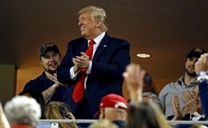 President Donald Trump waves to the crowd during Game 5 of the 2019 World Series.