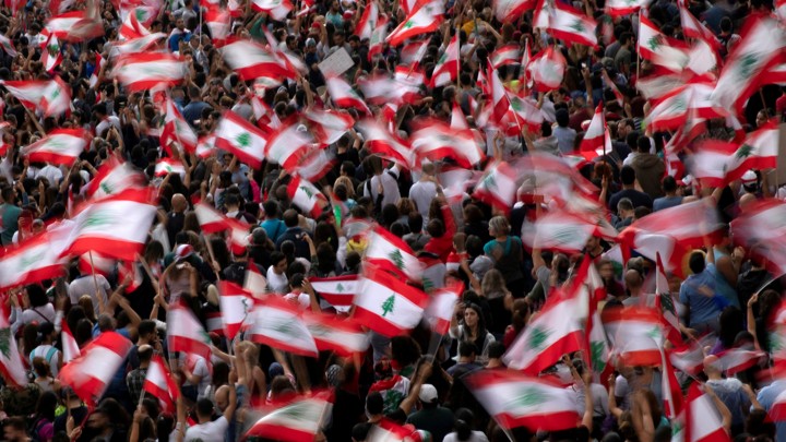 Demonstrators wave Lebanese national flags