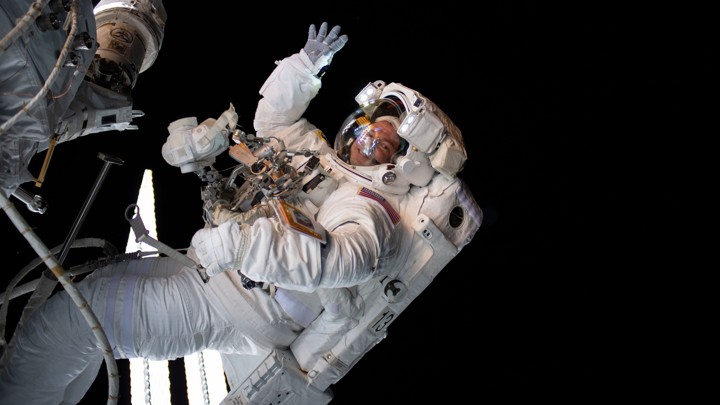 The astronaut Drew Morgan waves during a spacewalk.