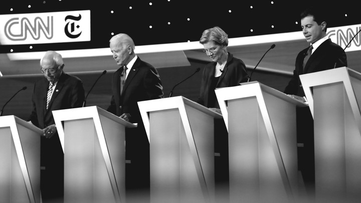 Senator Bernie Sanders (I-VT), former Vice President Joe Biden, Senator Elizabeth Warren (D-MA), and South Bend, Indiana, Mayor Pete Buttigieg look down during the Democratic presidential debate.