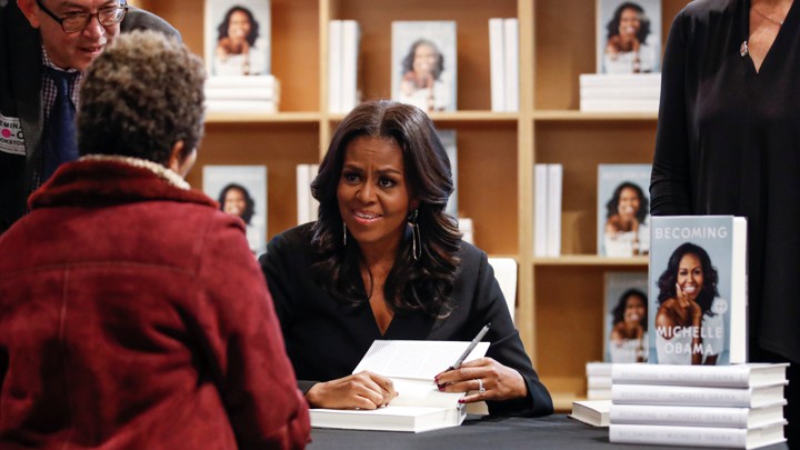 Michelle Obama signing books