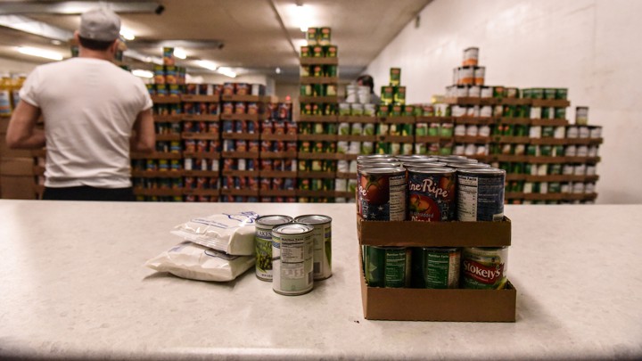 Factory worker stacking cans