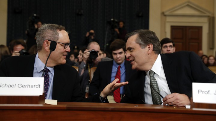 The University of North Carolina School of Law professor Michael Gerhardt (left) talks with the George Washington University Law School professor Jonathan Turley.