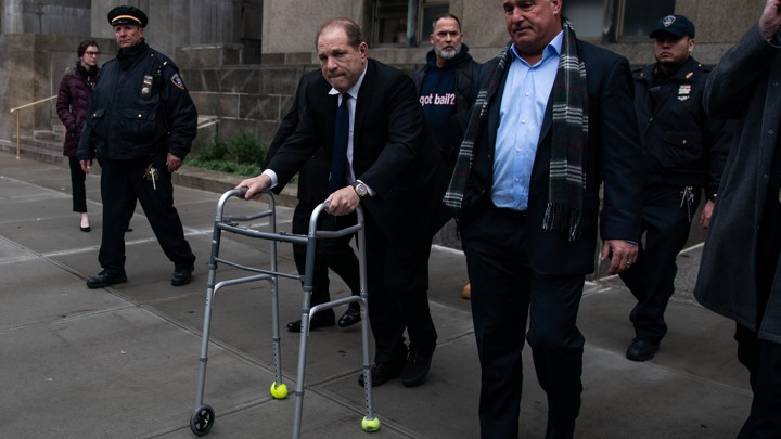 Harvey Weinstein, with the aid of a walker, leaves court following a December 11, 2019, hearing in New York City.
