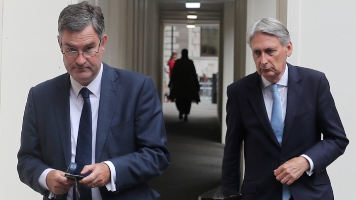 A photo of David Gauke and Philip Hammond.